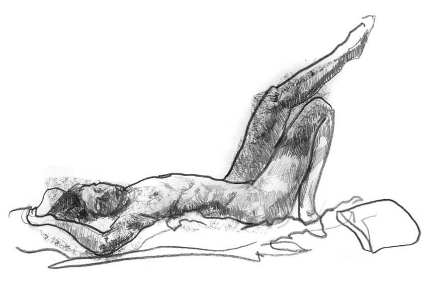Female model laying down with arms extended above her head and legs bent and raised in the air
