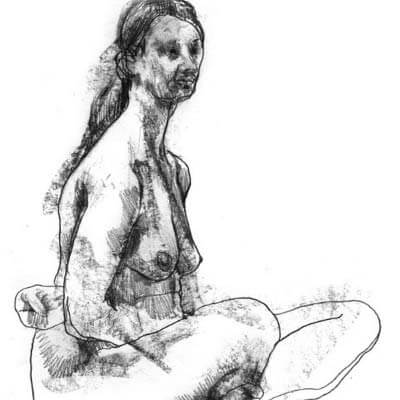Seated woman is locking arms and looking forward