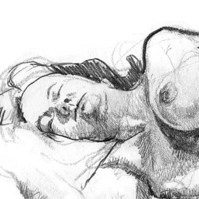 Female model laying with head on pillow.